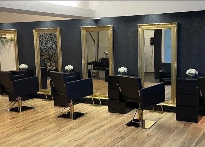 Èlan by Ruby salon interior in Stornoway, Scotland, GB with elegant mirrors and stylish chairs.