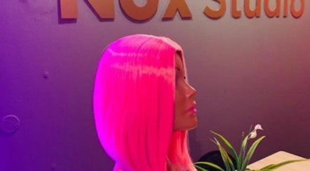 Vibrant mannequin with pink hair at Nox Beauty Studio, Kempton Park, Gauteng, ZA.