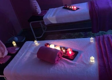 Relaxing massage room at Nox Beauty Studio, Kempton Park, Gauteng, ZA with soft lighting and candles.