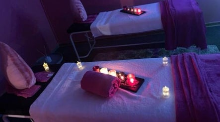 Relaxing massage room at Nox Beauty Studio, Kempton Park, Gauteng, ZA with soft lighting and candles.