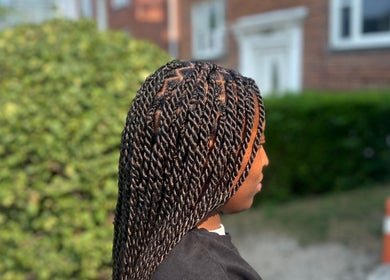 Detailed twist braids style by Fav_Ottawa_braider in Ottawa, Ontario, CA, showcasing intricate hair artistry.
