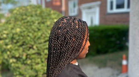 Detailed twist braids style by Fav_Ottawa_braider in Ottawa, Ontario, CA, showcasing intricate hair artistry.