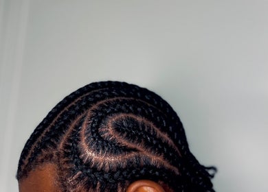 Stylish braided hairstyle by Fav_Ottawa_braider in Ottawa, Ontario, CA. Close-up view of detailed braiding.