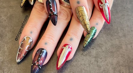 Intricately designed nails at Fingered Nails, Brighton And Hove, England, GB showcasing vibrant artistic nail art.