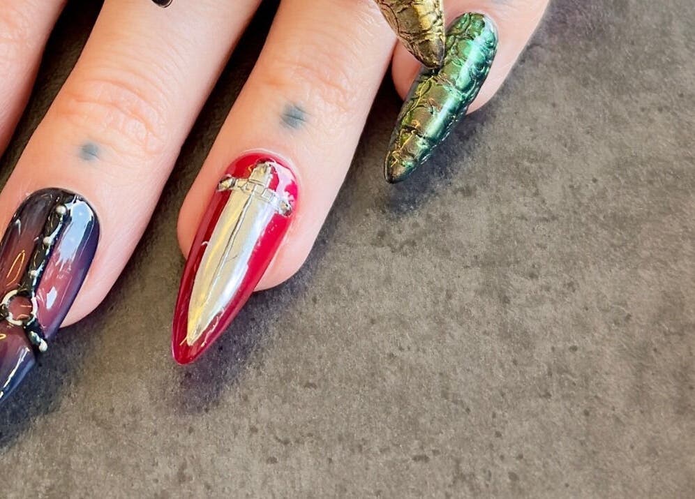 Intricate nail art at Fingered Nails, Brighton And Hove, England, GB showcasing edgy designs and vibrant colors.