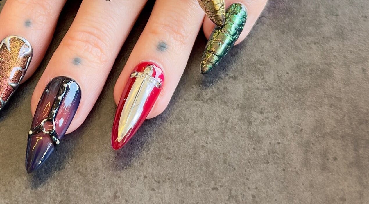 Intricate nail art at Fingered Nails, Brighton And Hove, England, GB showcasing edgy designs and vibrant colors.