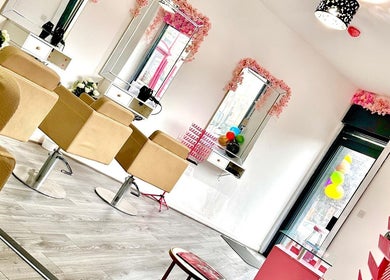 Stylish salon interior at Teemasbeautyplaceltd, Bradford, England, GB with plush chairs and elegant decor.