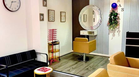Modern salon seating at Teemasbeautyplaceltd, Bradford, England, GB. Elegant design with comfy chairs and stylish décor.