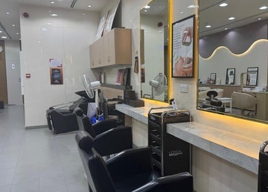 Modern salon chairs and mirrors at Layali Al Zahra Beauty Salon in Dubai, AE, showcasing a stylish ambiance.