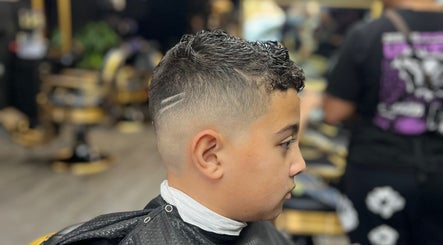 A stylish boy's fade haircut at Vic Fades, Santiago De Surco, Provincia De Lima, PE.