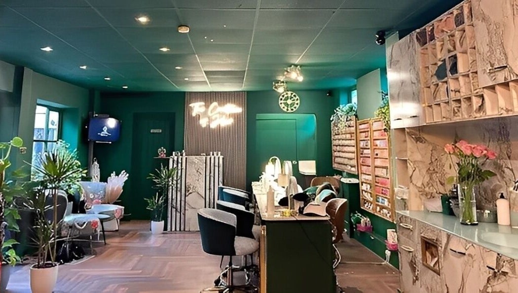 Stylish interior of Pinks Beauty & Spa, Hitchin, England, GB. Cozy seating and elegant decor.
