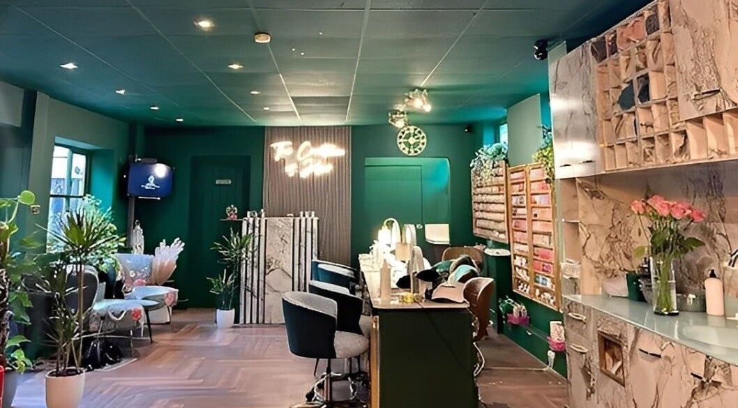 Stylish interior of Pinks Beauty & Spa, Hitchin, England, GB. Cozy seating and elegant decor.