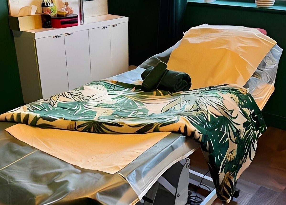 Serene massage bed at Pinks Beauty & Spa in Hitchin, England, GB, with tropical-themed decor.