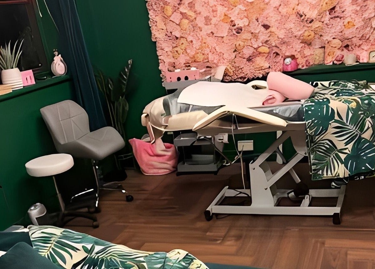 Relaxing treatment room at Pinks Beauty & Spa in Hitchin, England, GB, featuring lush decor and a massage bed.