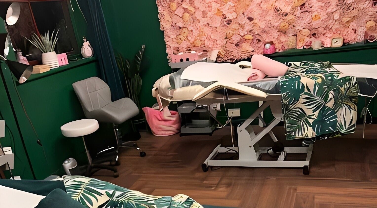 Relaxing treatment room at Pinks Beauty & Spa in Hitchin, England, GB, featuring lush decor and a massage bed.