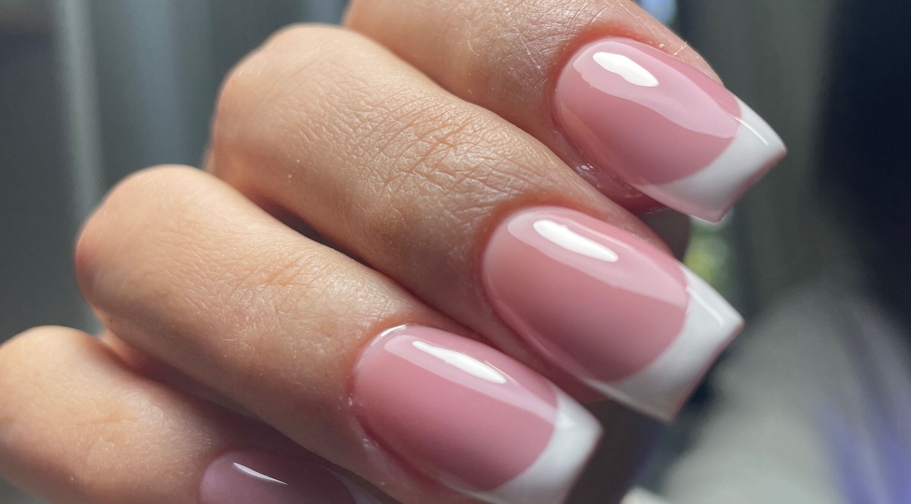 Elegant French manicure at Nails Eymen Güven, Muğla, Muğla, TR, showcasing glossy finish and soft pink tones.