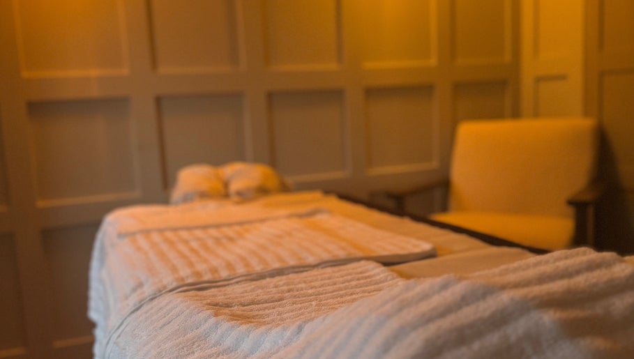Relaxing massage room at Vicky Bradley PT & Massage, Deal, England, GB, featuring soft lighting and cozy decor.