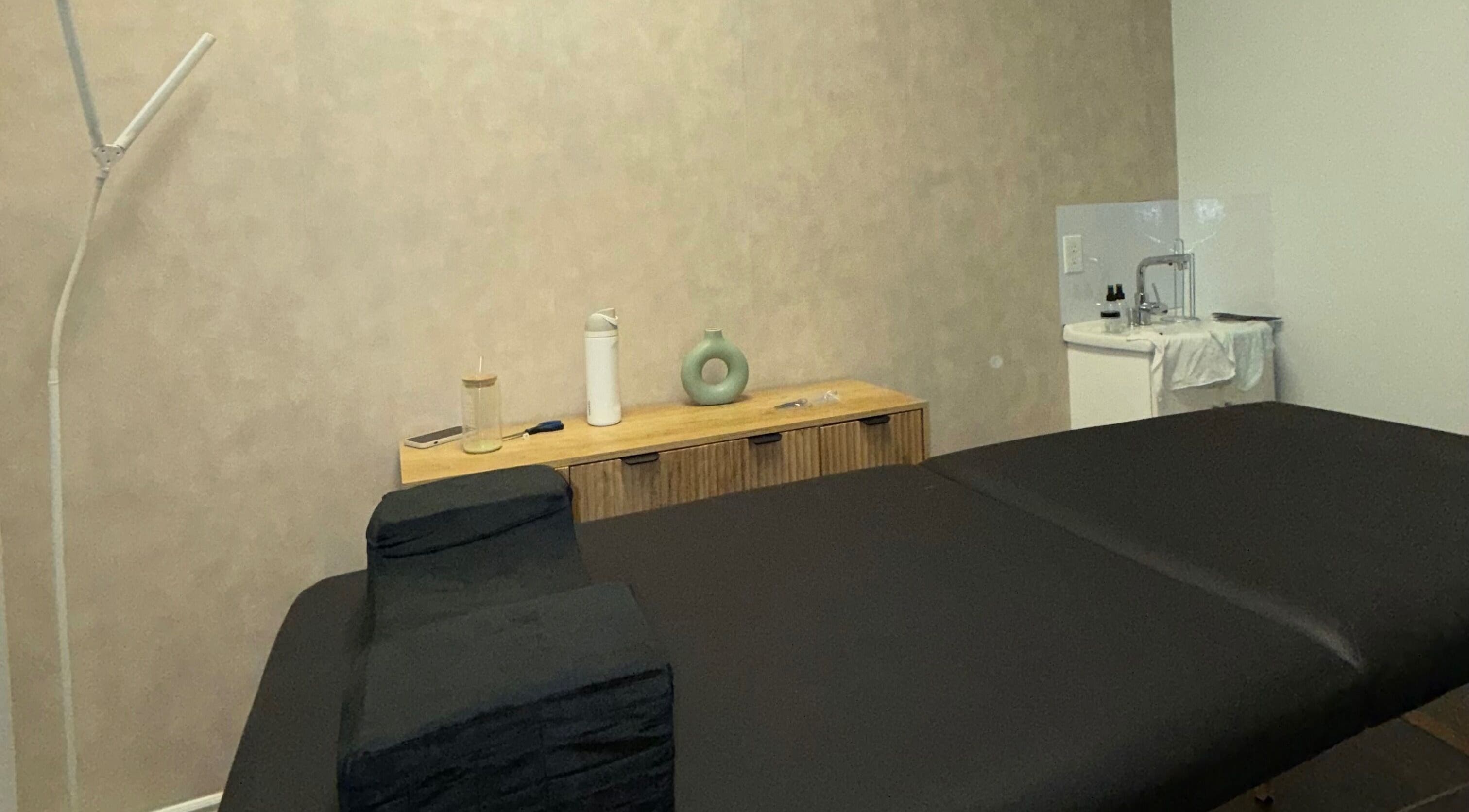 Relaxing treatment room at Skin Glow Studio, London, Ontario, CA, featuring a comfortable massage table.