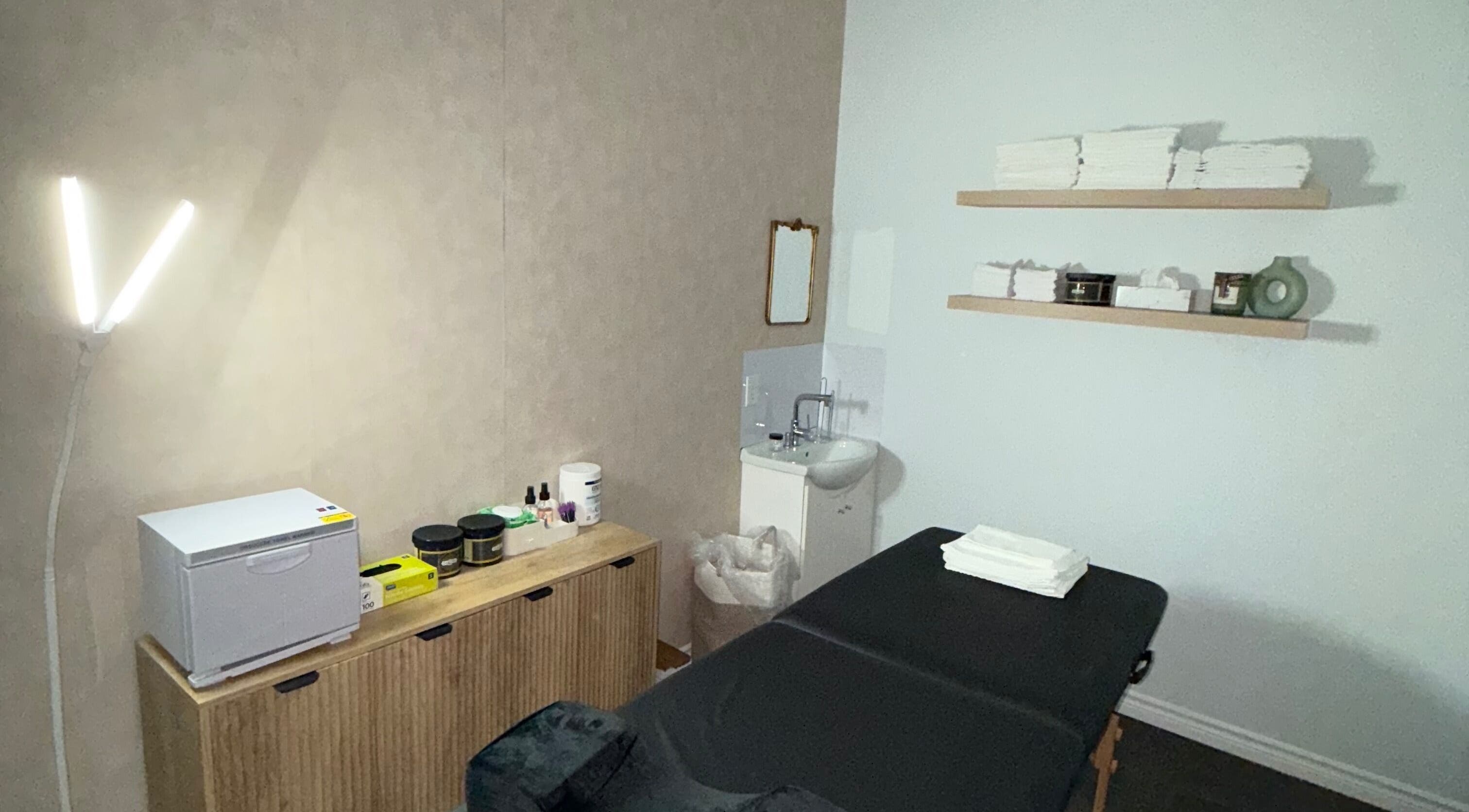 Serene treatment room at Skin Glow Studio x Sugar & Skin in London, Ontario, CA with soothing decor.