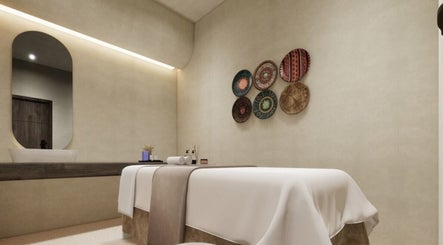 Elegant massage room at FOOT STEP, Sharjah, Sharjah, AE. Features cozy bed and artistic decor.