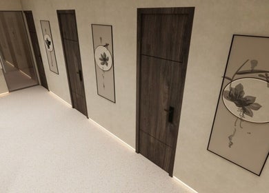 Minimalistic hallway at FOOT STEP, Sharjah, Sharjah, AE, featuring wooden doors and floral wall art.