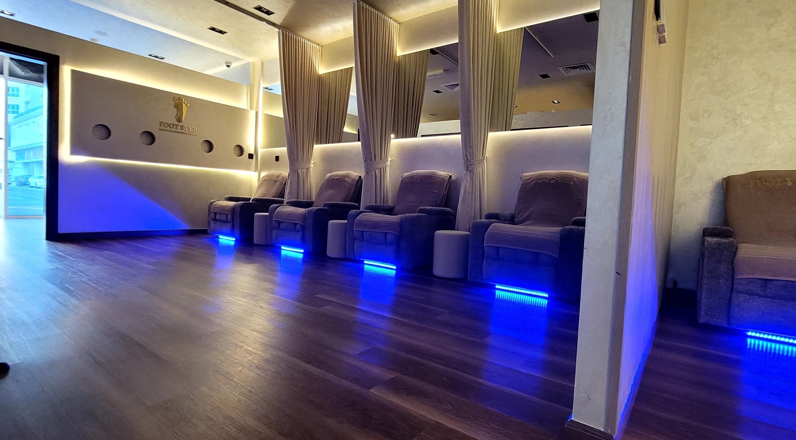 Relaxing chairs at FOOT STEP - Foot Reflexology Massage, Sharjah, Sharjah, AE. Ambient lighting for serene experience.