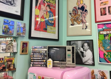 Eclectic retro decor in Dans Traditional Barbershop, Auckland, Auckland, NZ featuring vintage comics and art.