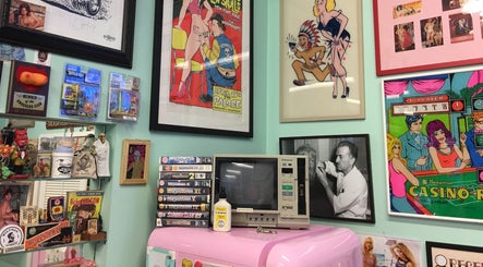 Eclectic retro decor in Dans Traditional Barbershop, Auckland, Auckland, NZ featuring vintage comics and art.