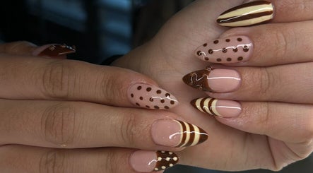 Stylish polka dot and striped nails designed at Adria Did My Nails in El Paso, Texas, US.
