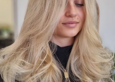 Blonde hair styled in loose waves at The Styling Room, Devonport, Tasmania, AU.