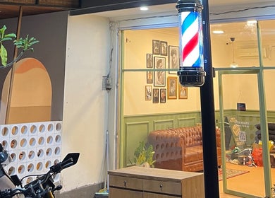 Charming view of Maison Barbershop in Bali, Bali, ID, featuring classic decor and barber pole.