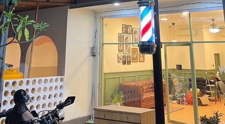 Charming view of Maison Barbershop in Bali, Bali, ID, featuring classic decor and barber pole.