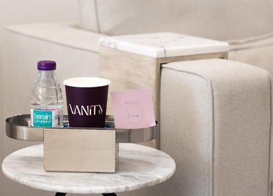 Refreshment setup at Vanity Beauty Lounge, Riyadh, Riyadh Province, SA, featuring water and a welcome note.