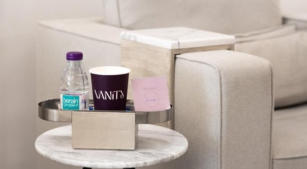 Refreshment setup at Vanity Beauty Lounge, Riyadh, Riyadh Province, SA, featuring water and a welcome note.