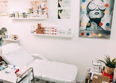 Bright treatment room at BALANCE AESTHETICS CARDIFF, Cardiff, Wales, GB. Modern decor with skincare products.