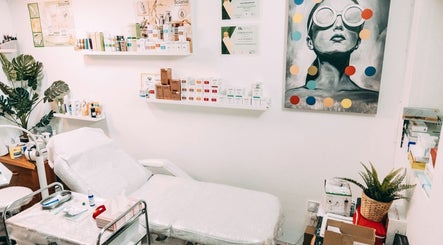 Bright treatment room at BALANCE AESTHETICS CARDIFF, Cardiff, Wales, GB. Modern decor with skincare products.