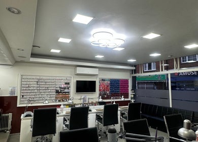 Chic interior of Usa Nails (Basingstoke), a beauty venue in Basingstoke, England, GB, showcasing manicure stations.