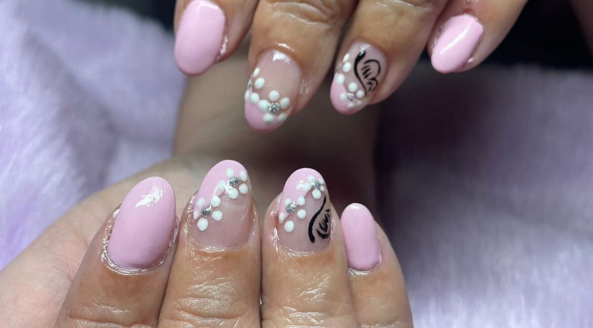 Elegant pink floral nail art at SassyNailsbyAnezane in Pretoria, Gauteng, ZA.