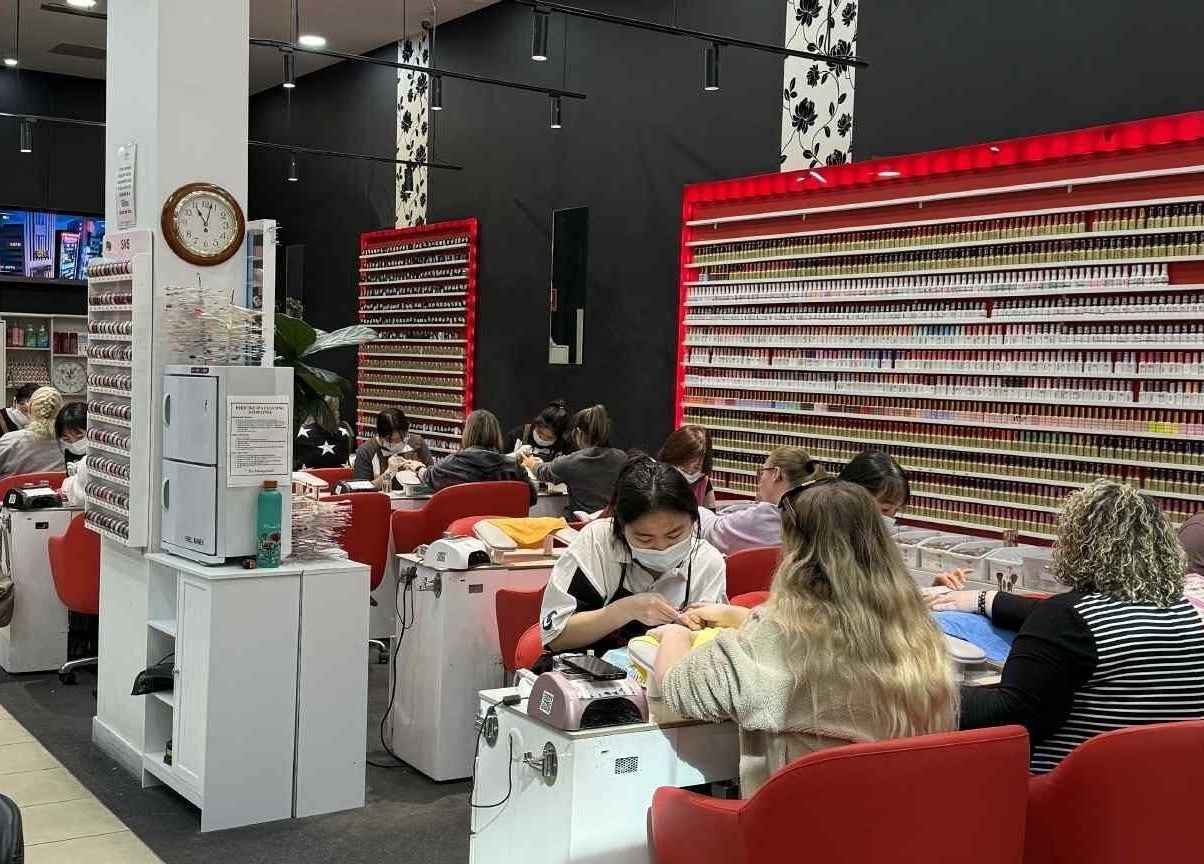 Guests enjoy manicures at Professionail Westfield Marion in Oaklands Park, South Australia, AU.