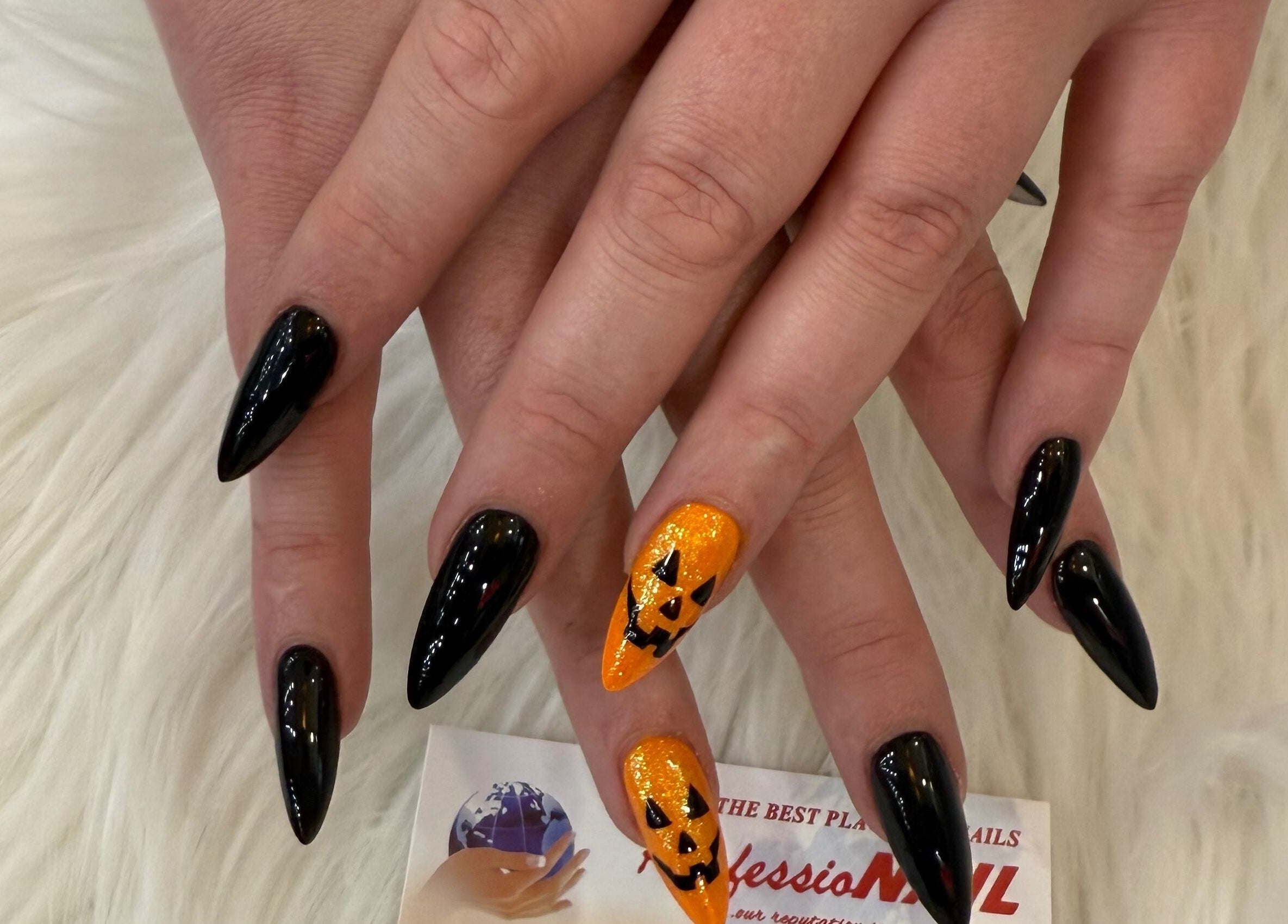 Stylish black and pumpkin nail art at Professionail Westfield Marion, Oaklands Park, South Australia, AU.