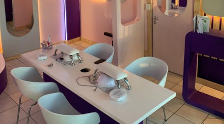 Modern manicure station at Mstudios, Cape Town, Western Cape, ZA with stylish white and purple decor.