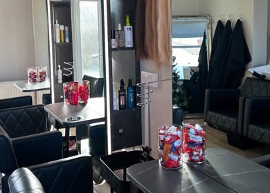 Sophia The Hairstylist venue in Ipswich, England, showcasing elegant salon interior with black chairs.