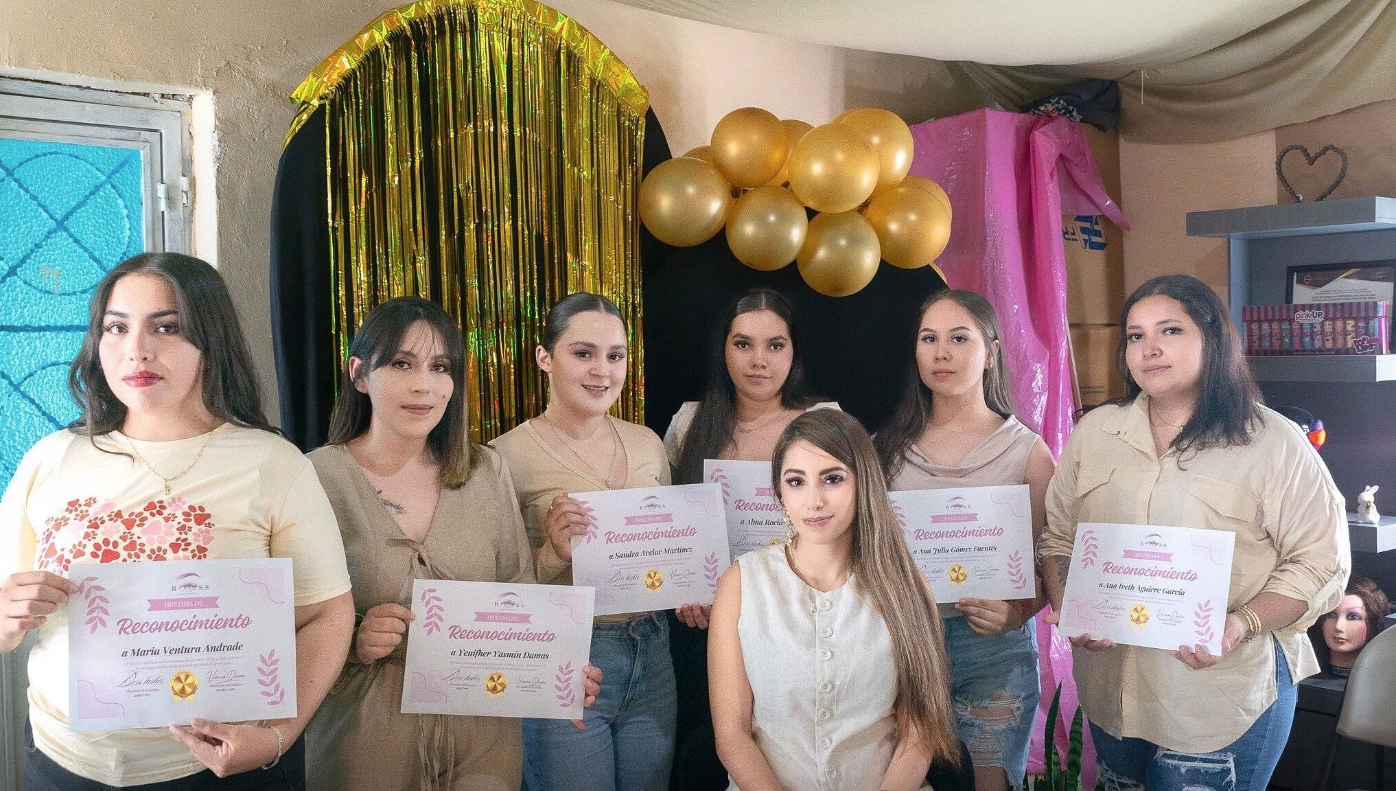 Group at BOSS LASHES in Zacatecas, Zacatecas, MX, holding certificates during a celebration event.