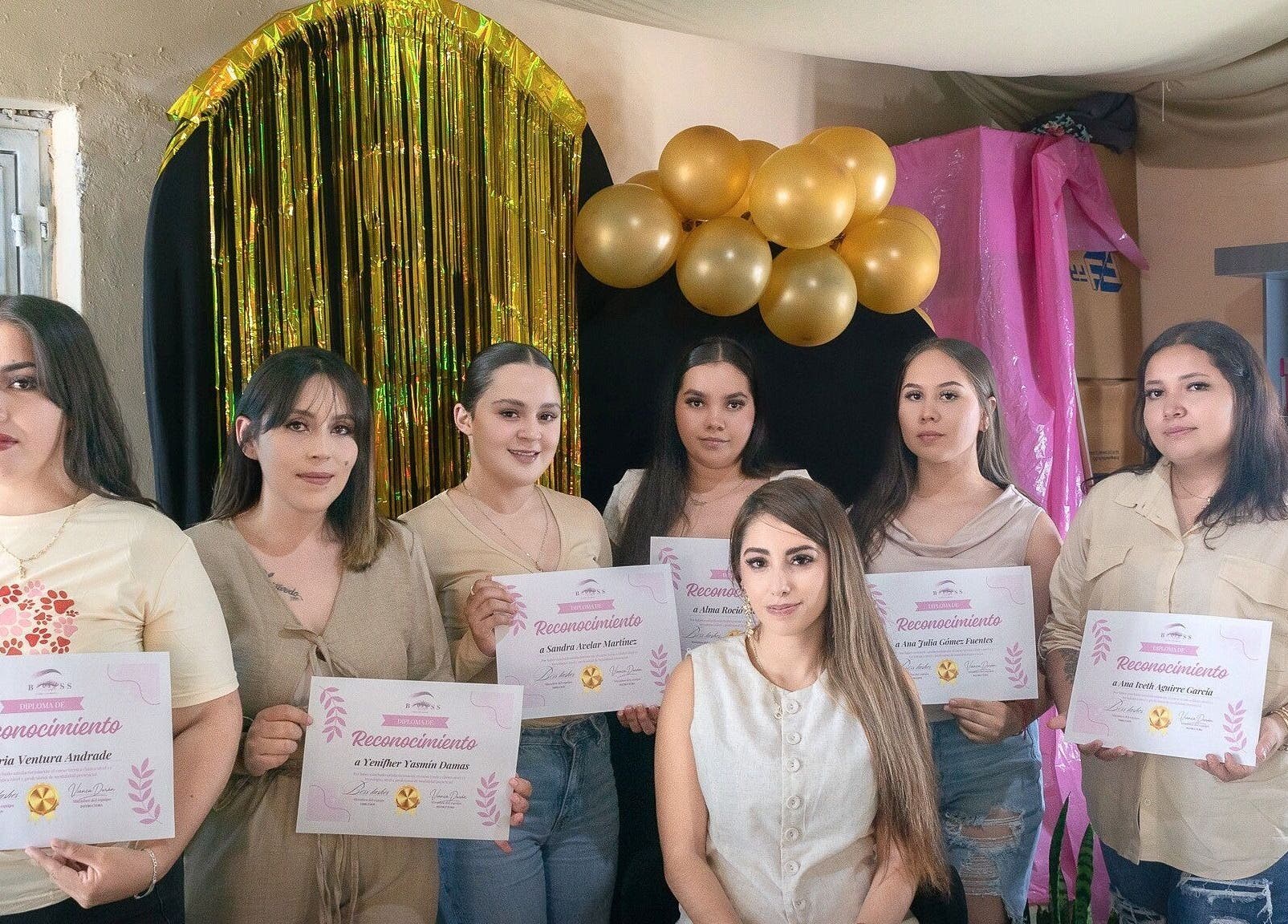 Group at BOSS LASHES in Zacatecas, Zacatecas, MX, holding certificates during a celebration event.