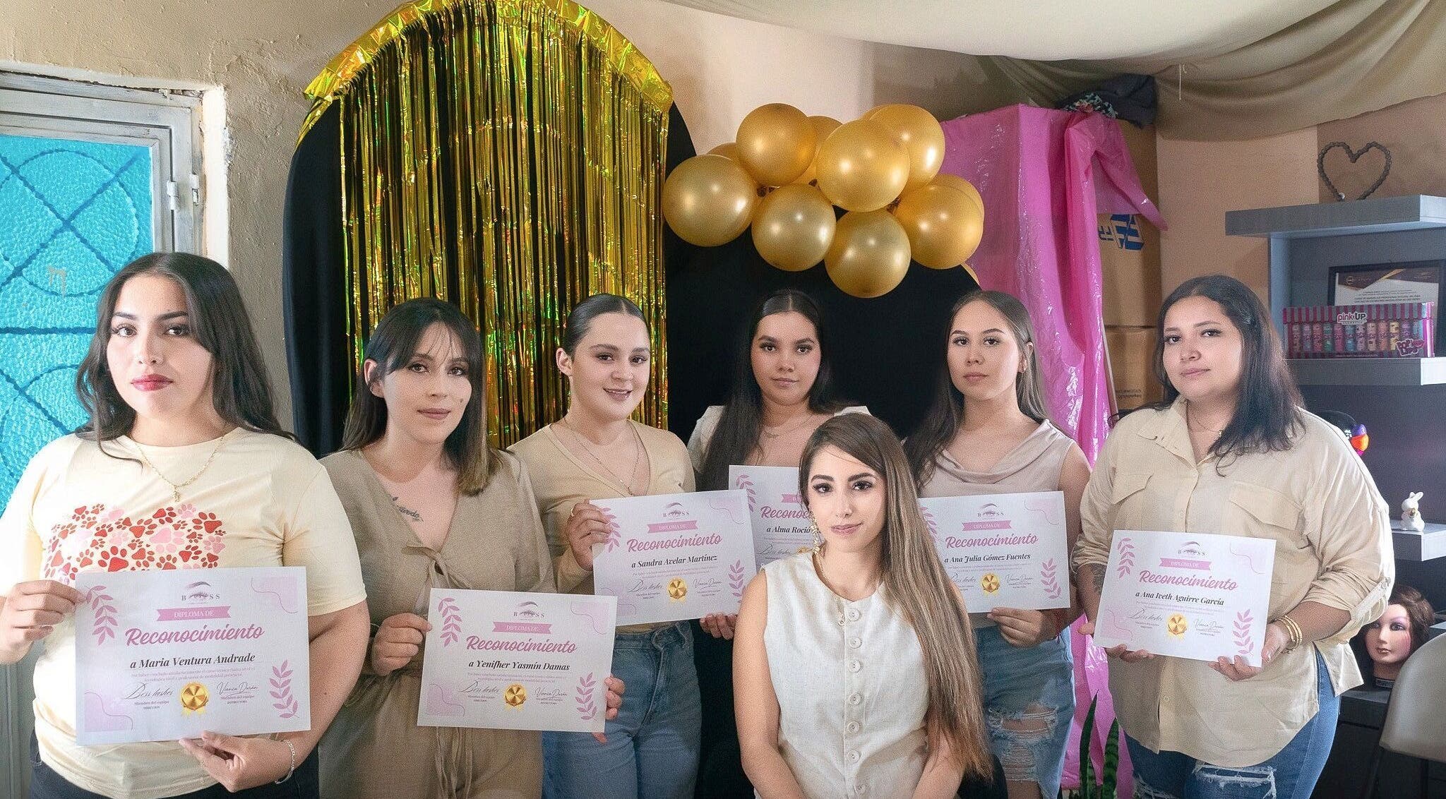 Group at BOSS LASHES in Zacatecas, Zacatecas, MX, holding certificates during a celebration event.