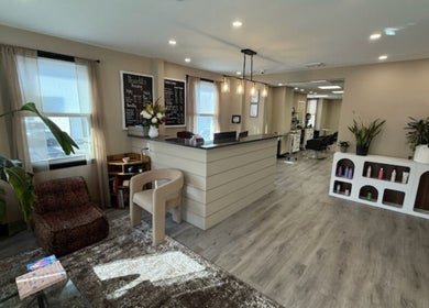 Brunetto Beauty's elegant reception area in Oakland, New Jersey, US, featuring modern decor and a welcoming atmosphere.