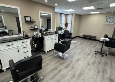 Modern salon interior at Brunetto Beauty, Oakland, New Jersey, US, featuring stylish chairs and fresh decor.