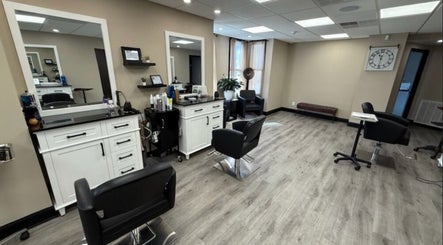 Modern salon interior at Brunetto Beauty, Oakland, New Jersey, US, featuring stylish chairs and fresh decor.