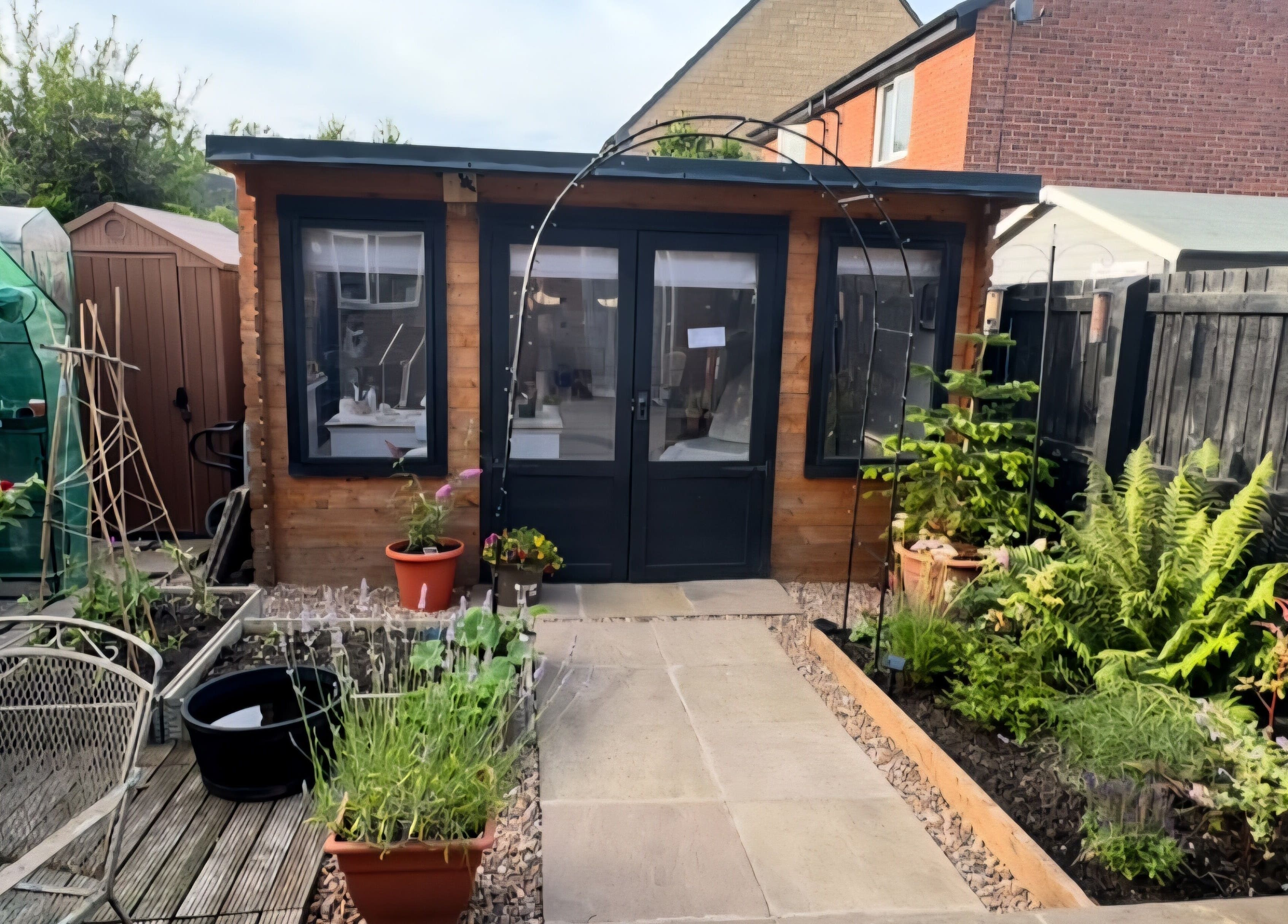 Beauty Bank venue with lush garden entrance in Clitheroe, England, GB, showcasing serene outdoor ambiance.