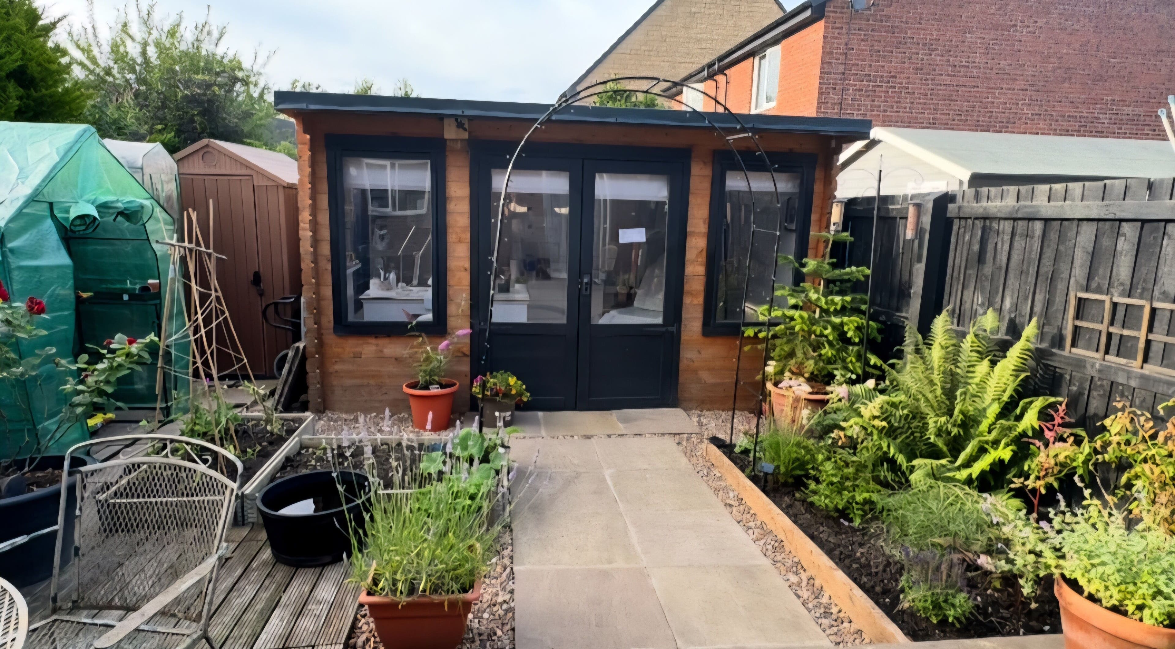 Beauty Bank venue with lush garden entrance in Clitheroe, England, GB, showcasing serene outdoor ambiance.